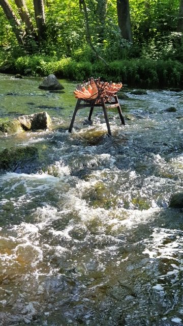 Photo of sculpture in a river