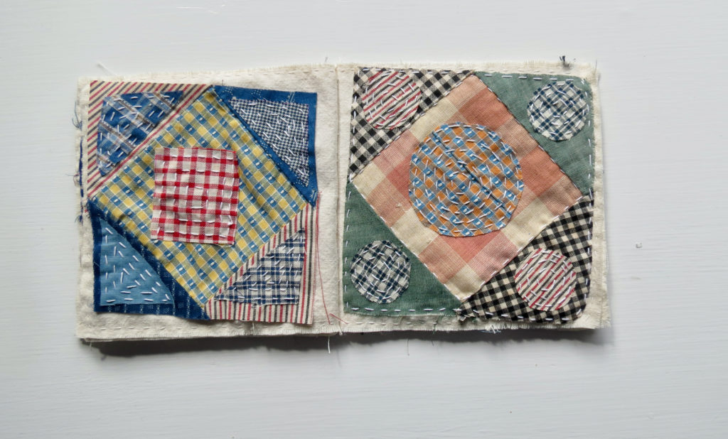 overlapping triangles, squares and circles of different patterns sewn together and crosstitched